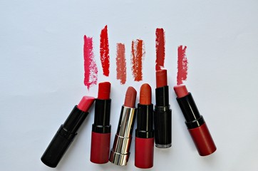 red lipstick on the white background - obrazy, fototapety, plakaty
