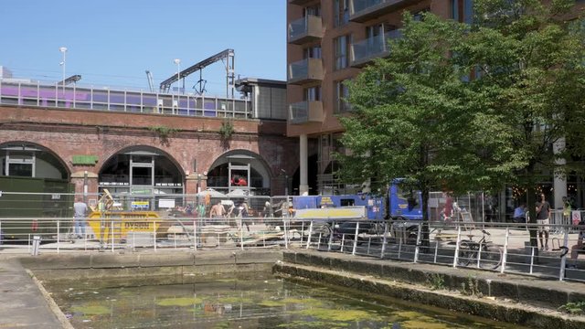 Workers by train station Leeds for flood damage