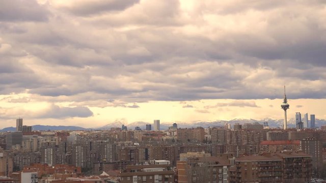 The skyscrapers four towers and television tower El Pirul in Madrid, Timelapse. Cityscape, background snowy mountain
