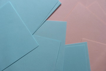 pink and blue sheets of paper close-up of sheets for notes blocks of straight lines background for decor