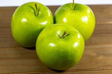 Tasty Green apples on a kitchen counter