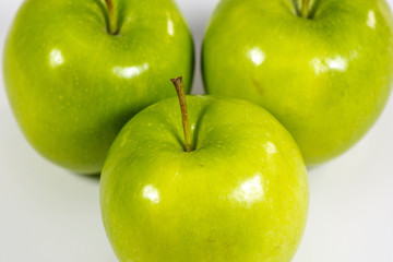 Tasty Green apples on a kitchen counter