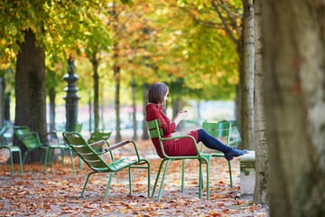 Young woman in Paris by fall