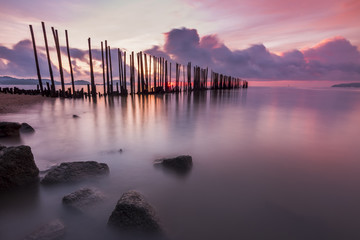 A beautiful seascape with motion of waves and twilight sunrise sky