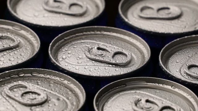 footage water droplets on can of soda or beer rotate background.