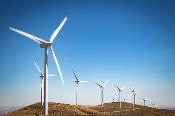 Fototapeta premium Wind Turbines Spin in the Wind at the Wild Horse Wind and Solar Engery Center - Wind Turbines