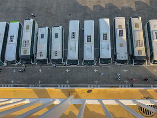 Tour Buses Lined Up on the Cruise Ship Pier, Waiting for Excursions to Commence