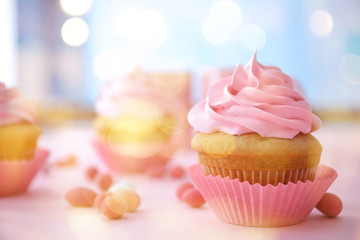 Delicious cupcake on table