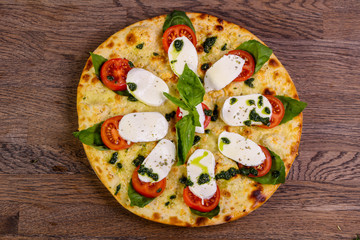 Pizza Caprese with basil