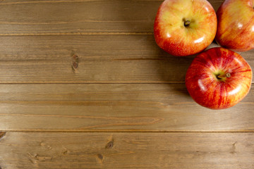 Red apples waiting to be eaten on the kitchen table