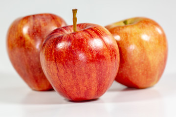 Red apples waiting to be eaten on the kitchen table