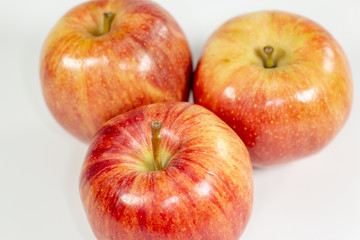 Red apples waiting to be eaten on the kitchen table