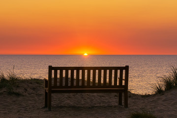 Fototapeta na wymiar Bench at Red Cliff on the island Sylt