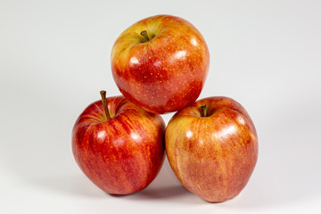 Red apples waiting to be eaten on the kitchen table