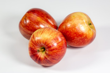 Red apples waiting to be eaten on the kitchen table