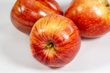 Red apples waiting to be eaten on the kitchen table