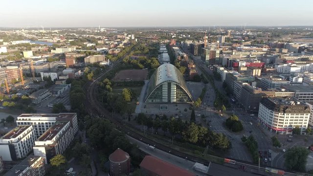 Aerial view of big glass shopping centre at Hamburg, Germany. Amazing sunset over the city.