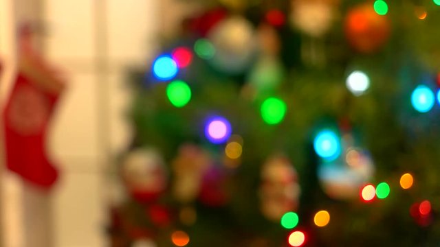 Blurred New Year tree with blinking lights. Abstract Christmas tree background. Happy New Year card.