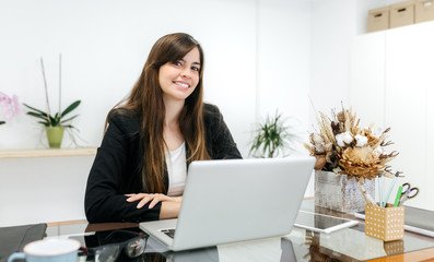 Portrait of a businesswoman sitting at her desk