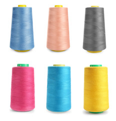 Set of colorful sewing threads on white background