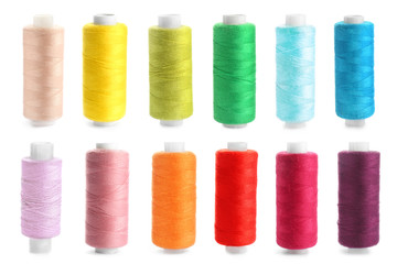 Set of colorful sewing threads on white background