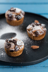 Three chocolate Muffin on table