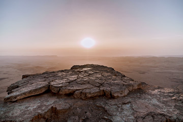 Sunrise in Israel dry negev desert. Amazing view on mountaines, rocks and sky. National park makhtesh ramon with beautiful landscapes