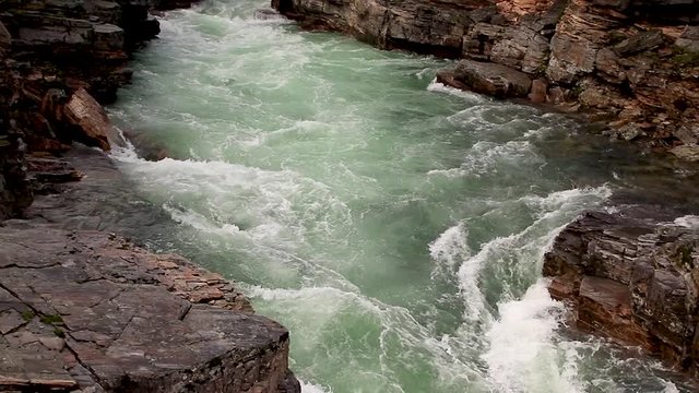Following a rivers flow in a canyon in northern Sweden an early morning. Location Kungsleden in Abisko national park.