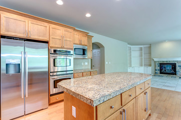 Amazing kitchen room with honey colored cabinets.