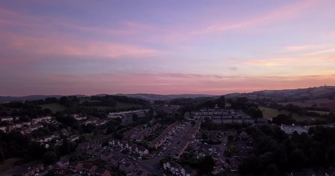 Drone footage; Panoramic view of the skyline at sunset in Exeter, U.K.