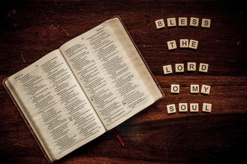 Flat lay of an open Bible and text