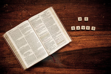 Flat lay of an open Bible and text