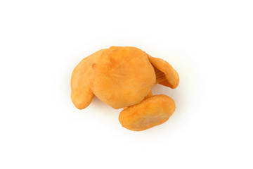 Four raw edible chanterelle mushrooms lie on each other isolated on white background