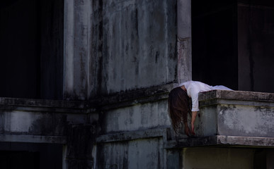 Fototapeta na wymiar Zombie Ghost woman murder on abandoned building with bloody