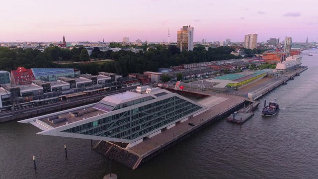 Aerial view of amazing sunset at port of Hamburg, Germany. Boats, ships and beautiful buildings.