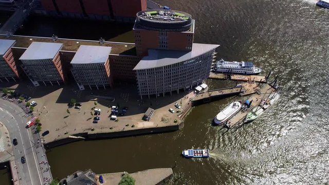 Aerial view of Hamburg, Hafencity (Germany). Boat under the bridge on river Elbe