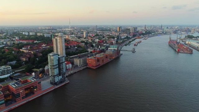 Aerial view of amazing sunset at port of Hamburg, Germany. Boats, ships and beautiful buildings.