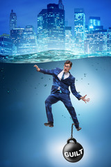 Businessman drowning under the burden of sin and guilt - obrazy, fototapety, plakaty
