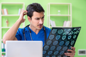 Young doctor working in the hospital