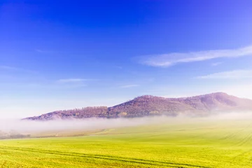 Fotobehang Green field and hill landscape © anetlanda