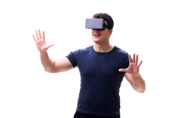 Naklejka premium Man playing with virtual reality glasses on white background