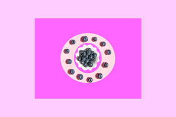Large fresh garden berries blueberries, white plate with copy space for text on a colored background. The concept of vegetarian and healthy summer food. 
