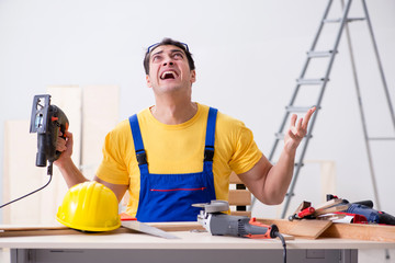 Floor repairman disappointed with his work 