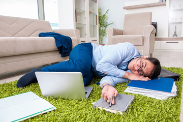 Tired and exhausted businessman relaxing after hard day