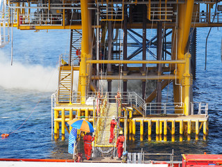 Cement dust from jack up rig is blown near platform sea deck.