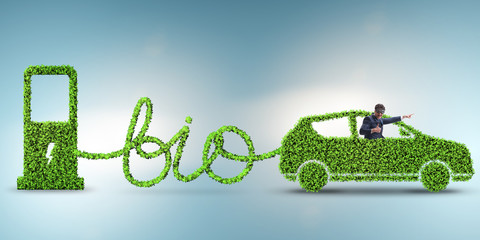 Businessman with car powered with biofuel - obrazy, fototapety, plakaty