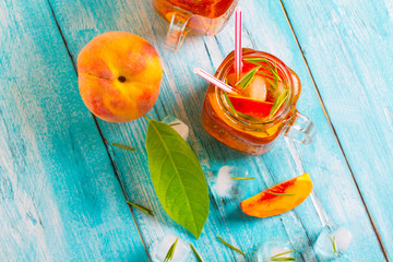 ice tea peach fresh wooden background
