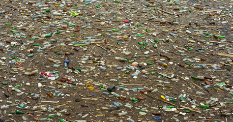 lake pollution with plastic bags and toxic waste in the water