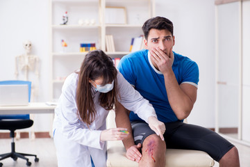 Fototapeta premium Patient visiting doctor after sustaining sports injury