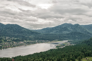 mountain summer landscape with views of the lake on a rainy day. high mountain view